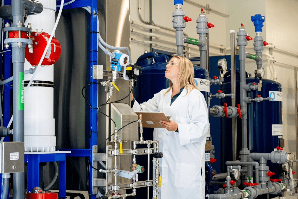 Scientist looking at filtration system at new Clay County Utility Authority advanced reclaimed water demonstration facility