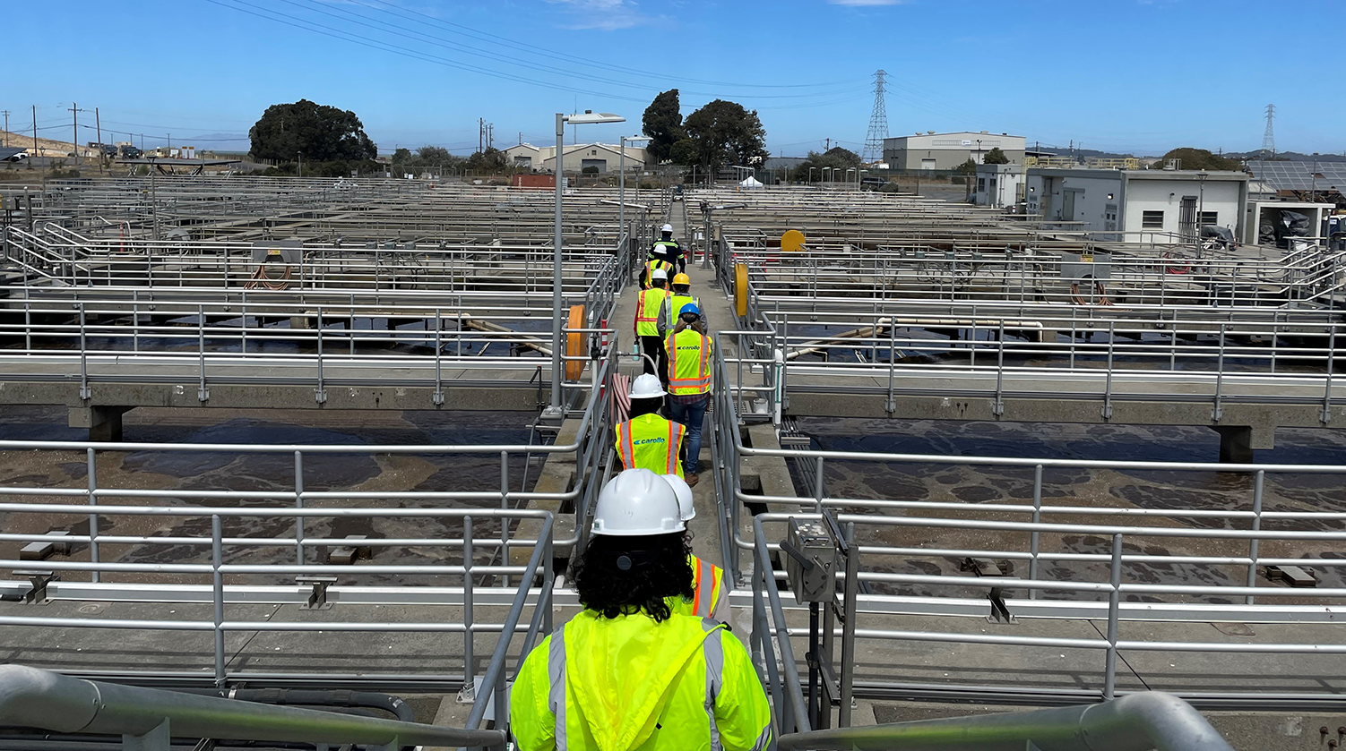 Carollo Engineers team members exploring a wastewater treatment facility for resilience management.