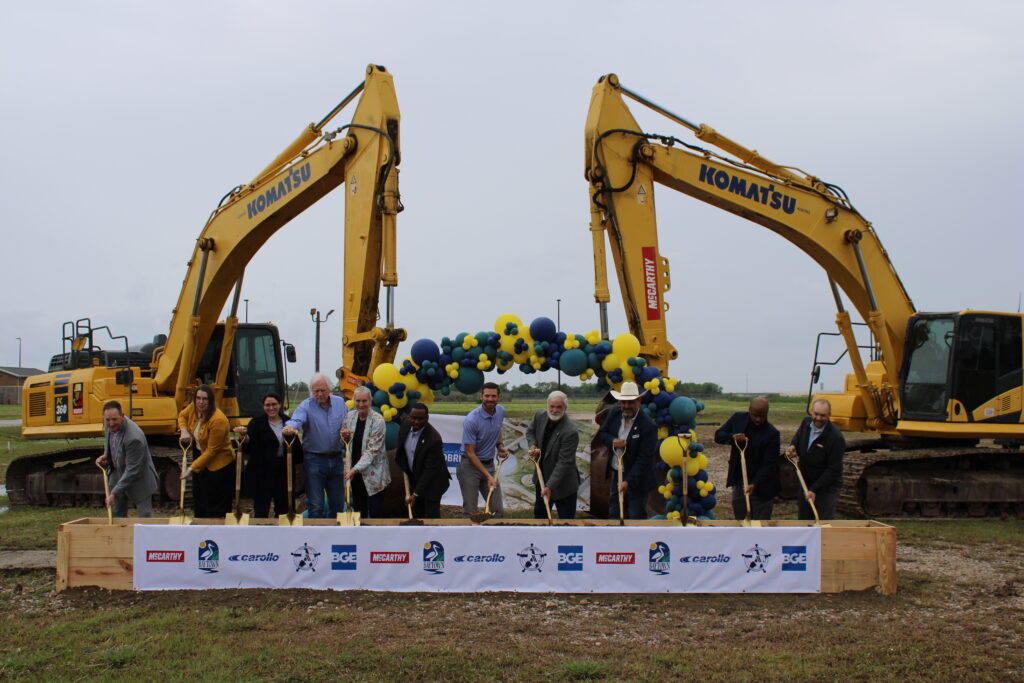 photo of several people with shovels in front of excavators at in Baytown Texas for the groundbreaking of a new water treatment facility
