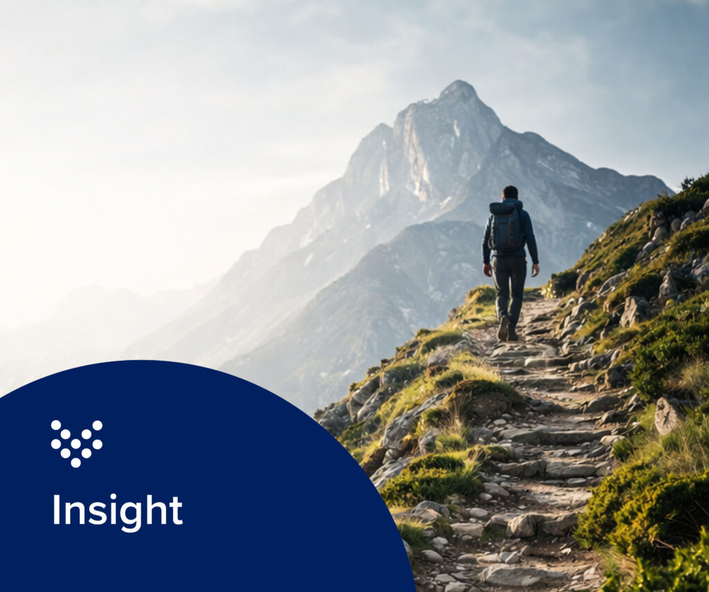photo of a hiker on a mountain representing the journey a water utility can take towards operational resilience